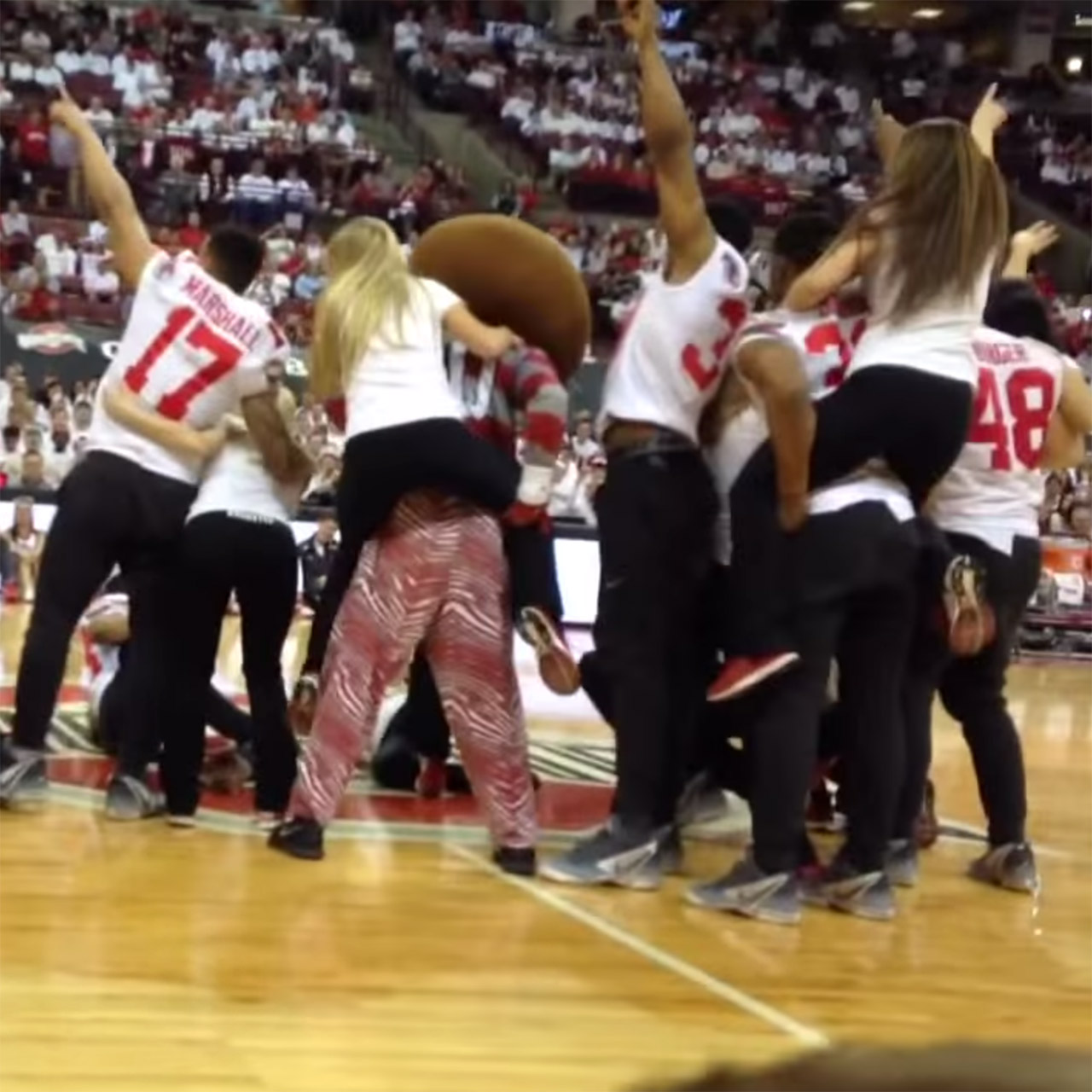 Buckeyes football team form dance crew for halftime entertainment at Ohio State basketball game