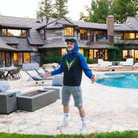 Logan Paul stands in front of his $6.6M mansion in Encino, California
