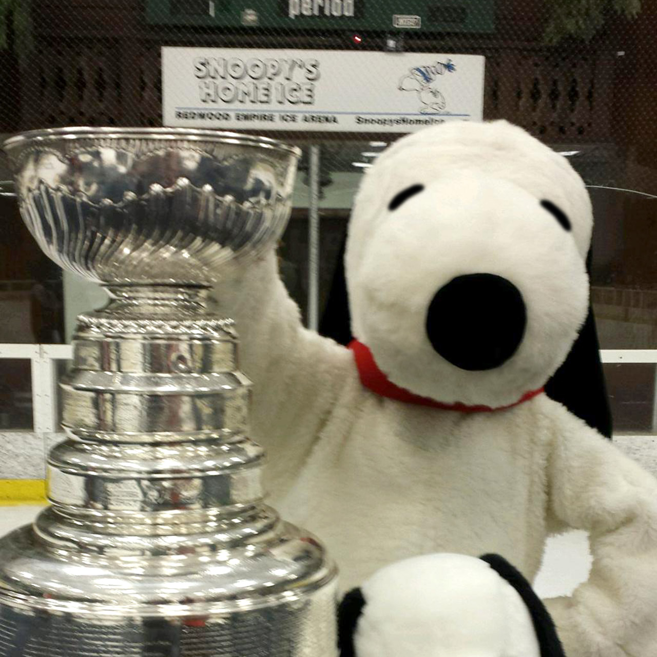 Snoopy posing with the Stanley Cup