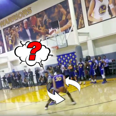 Steph Curry goes behind the back before sinking three point shot