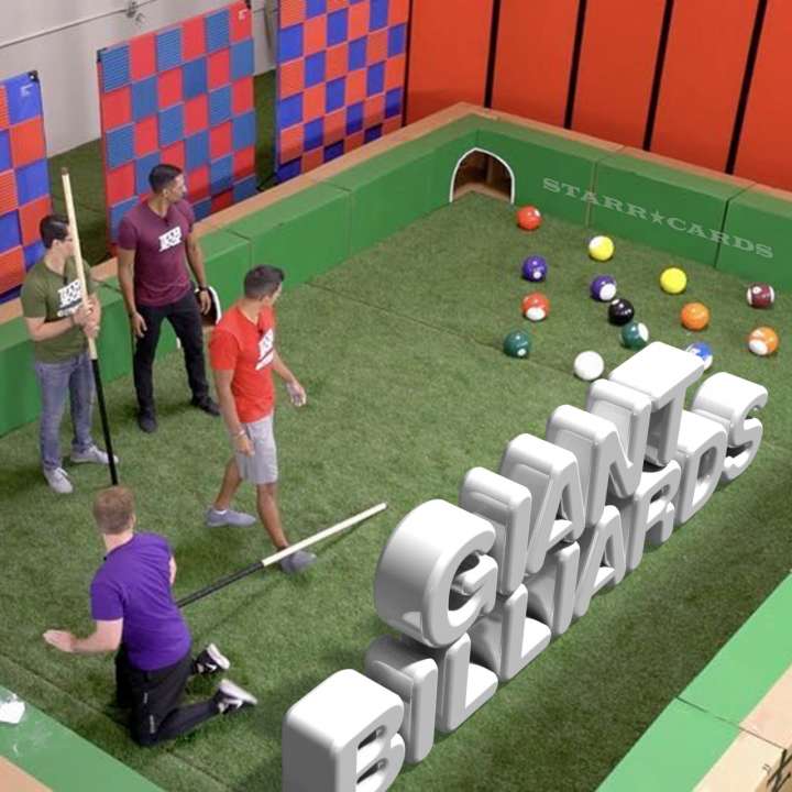Team Edge plays giant billiards with soccer balls